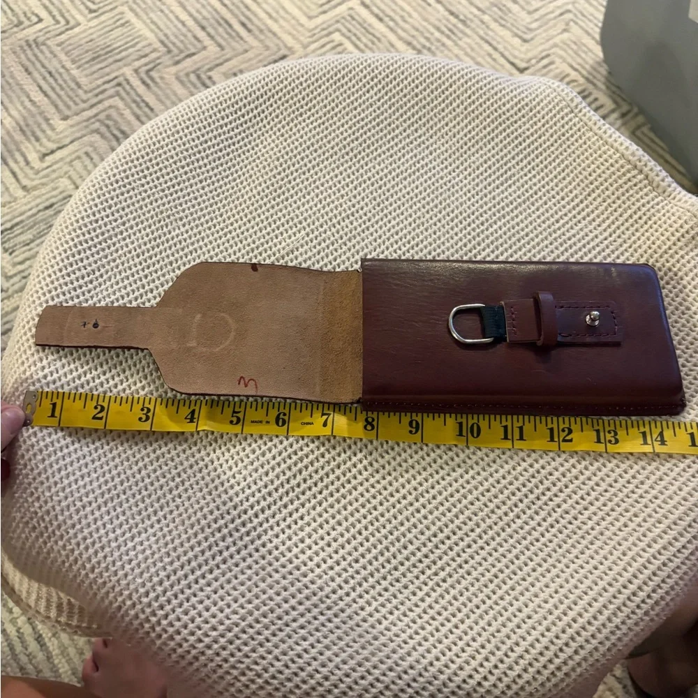 HANDMADE leather cell phone holder. See pictures for measurements. Never used.
